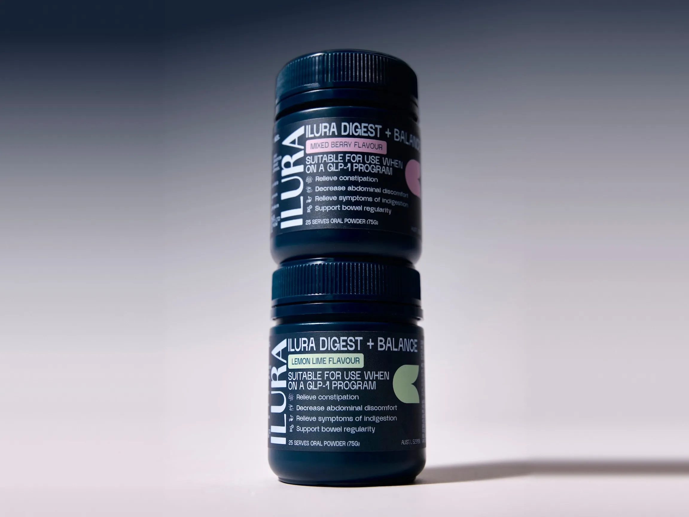 Two tubs of Ilura Digest + Balance, Mixed Berry and Lemon Lime, stacked